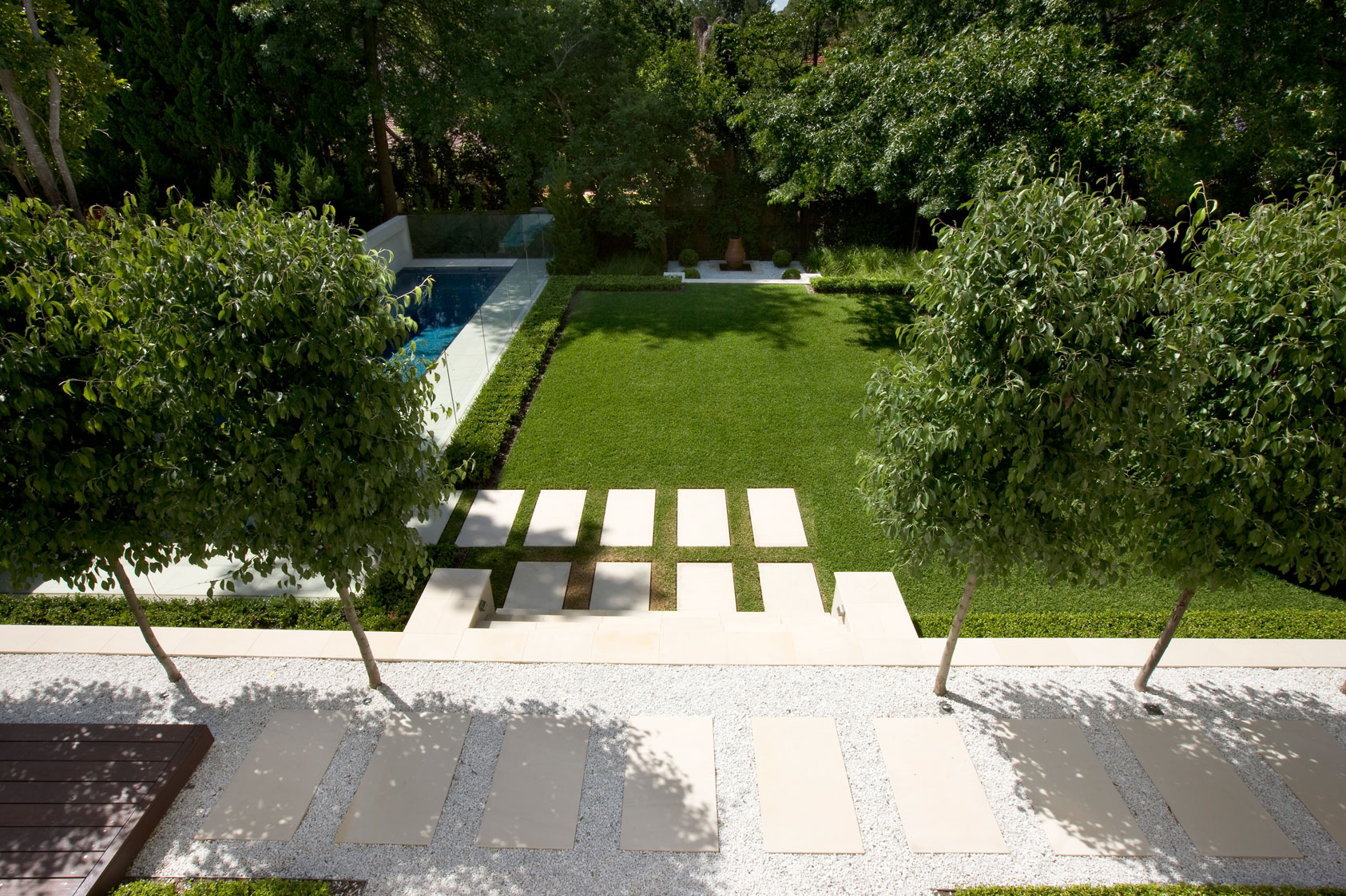 Looking down from above on gravel path with rectangle stones